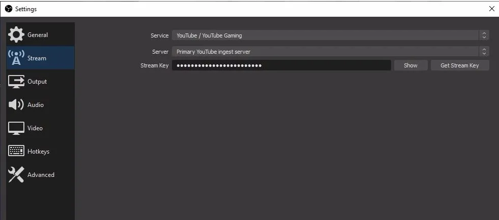 OBS stream settings with YouTube service and stream key pasted