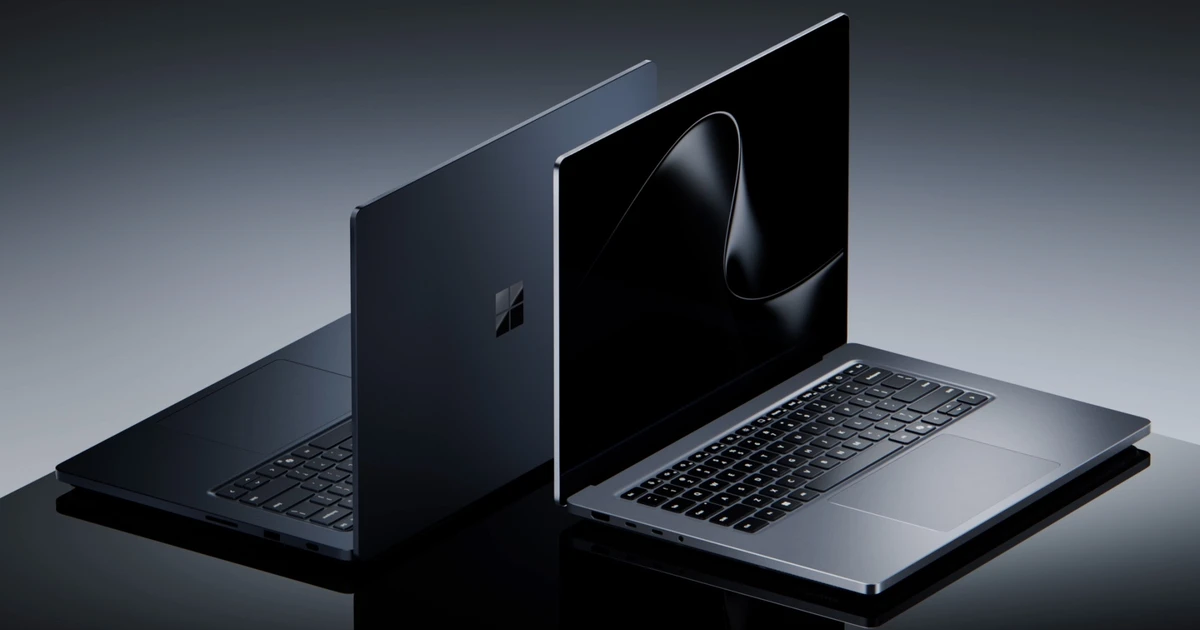 Two Surface Laptop Ultra units open back to back on a glossy dark surface, one in dark Nightfall showing the Microsoft logo on its lid and one in Platinum showing its keyboard and touchpad